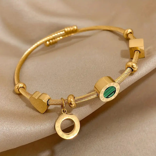 Gold rigid bracelet with geometric pendants - Celeste