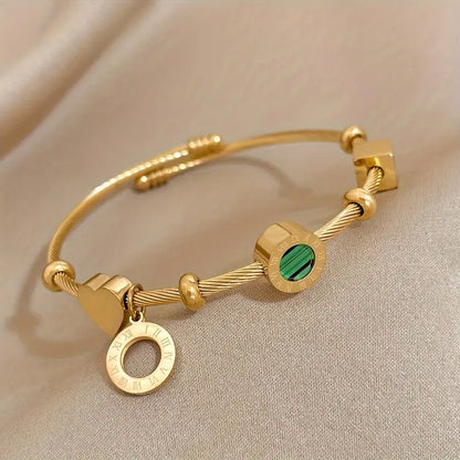 Gold rigid bracelet with geometric pendants - Celeste